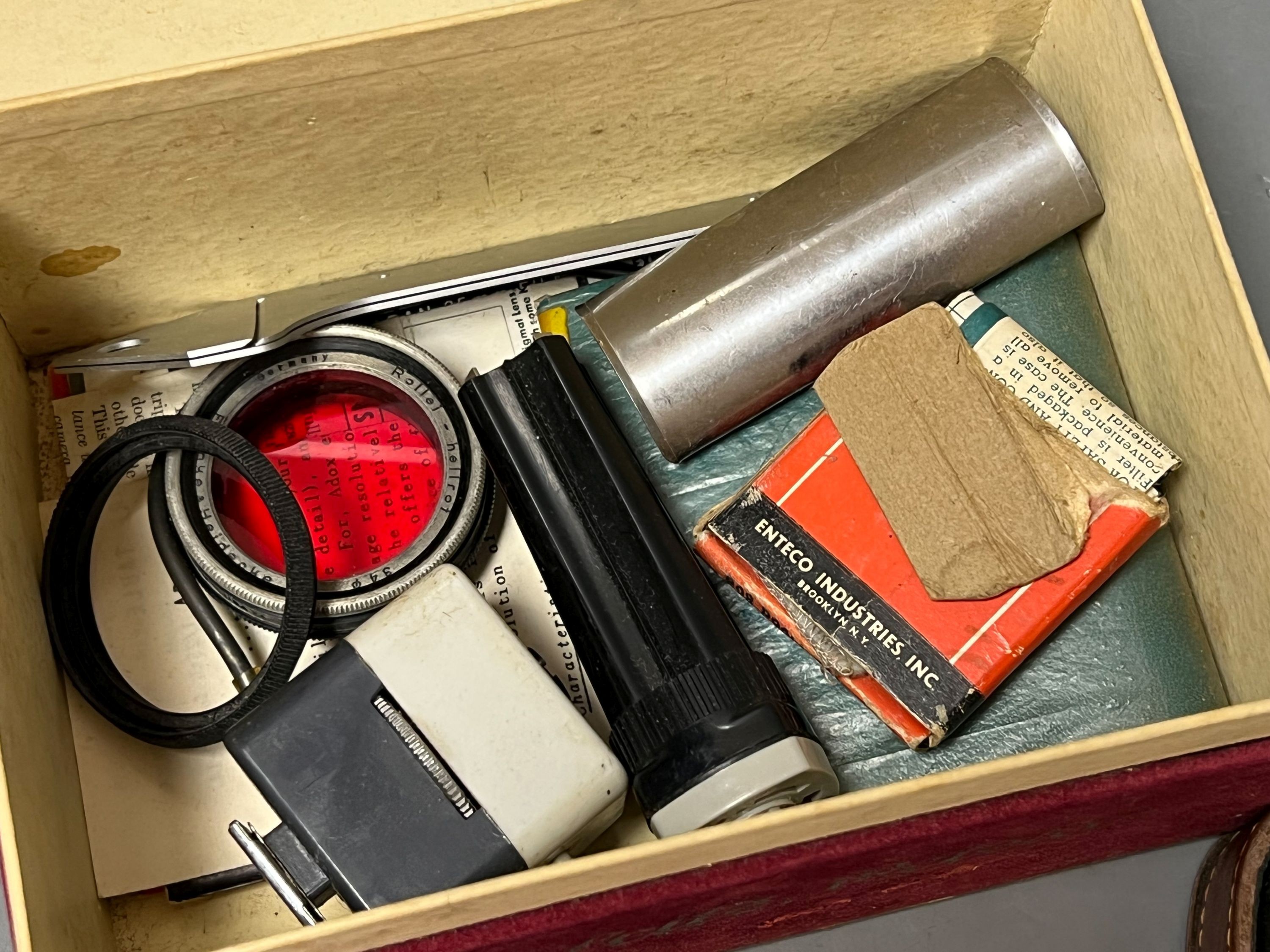 A cased Leica Ernst Leitz Wetzlar nr. 606583 camera together with light meter, lenses etc.